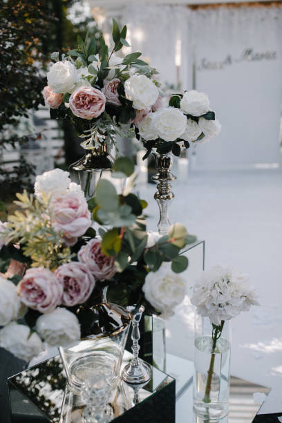 istock Indoors wedding decoration with fresh flowers 1053865074