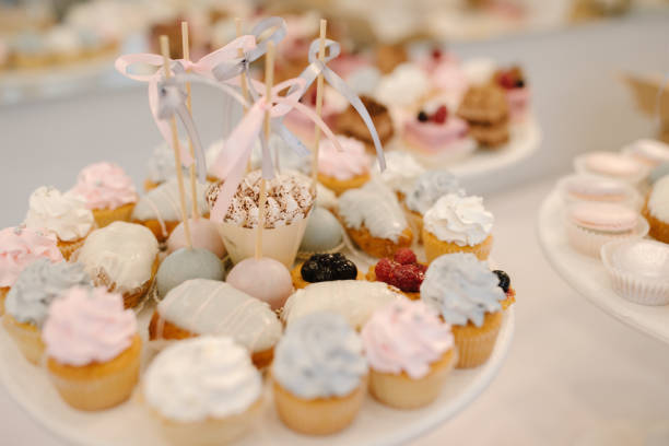 istock Candy bar with small cakes in light colors 1053865078