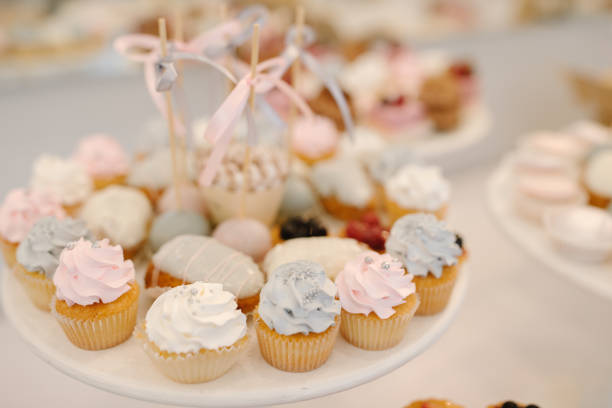 istock Candy bar with small cakes in light colors 1053865092