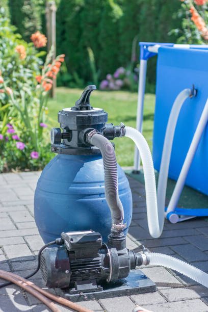 istock Sand filter with pump on a pool to keep the pool water clean 1053866288
