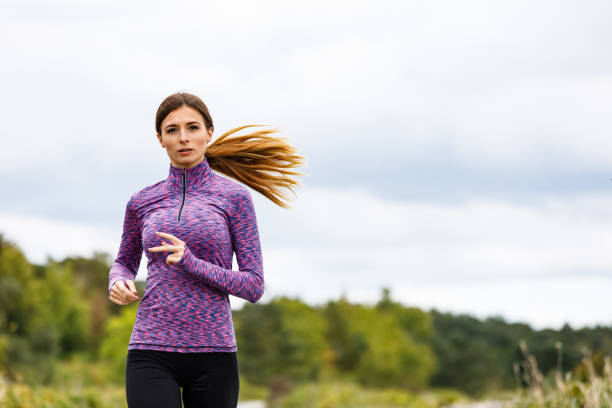 istock Woman jogging in park 1053867604
