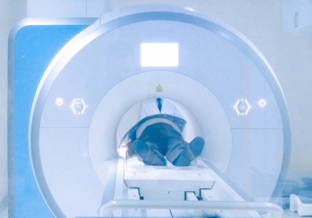 istock Old man having an MRI Scan in hospital 1053870204