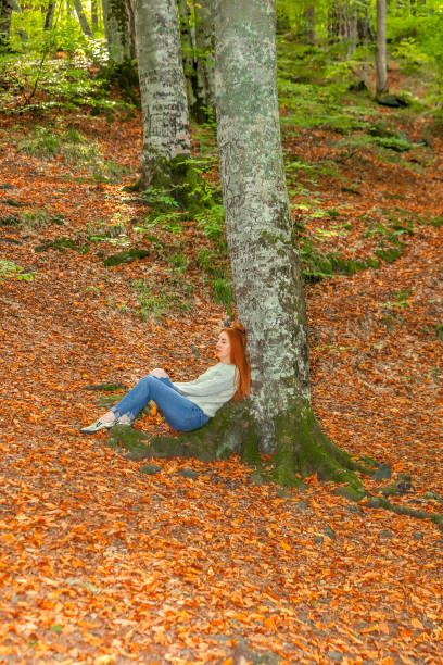 istock Portrait with Orange color Autumn Leafs 1053870468