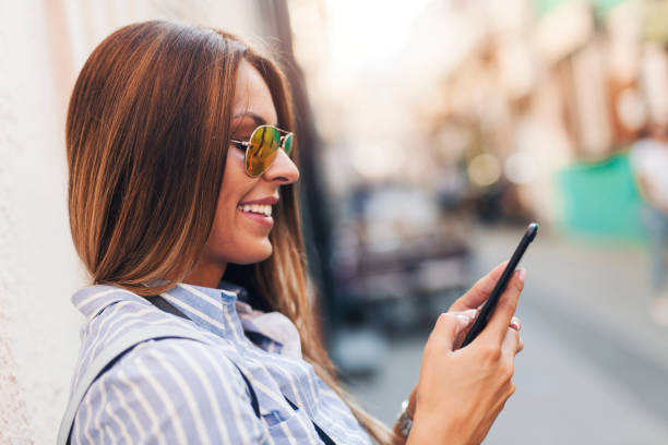 istock Tourist girl using smart phone 1053875112