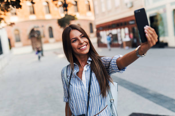 istock Tourist girl taking selfie 1053875584