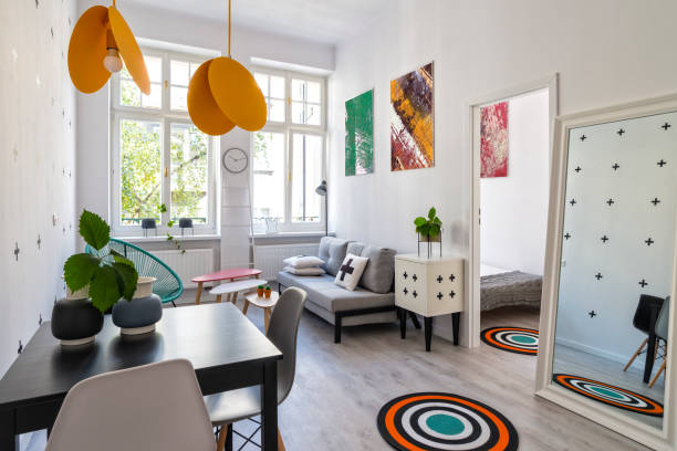 Scandinavian interior, small cosy flat in white with some colors stock photo