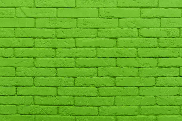 istock green brick wall painted at saturated lime colour. texture 1053882438