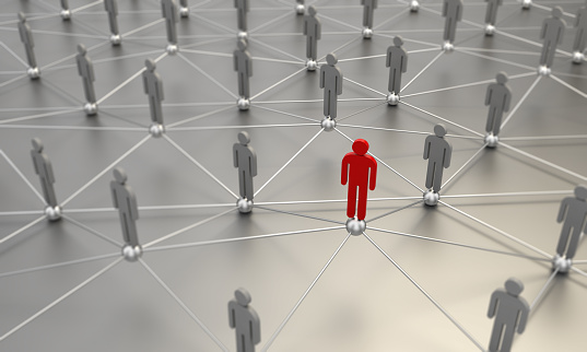 Standing out from the crowd concept with a red man between the gray ones. Can be used also social network connections. ( 3d render )
