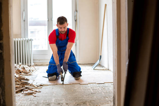 istock Handyman during work of removing old flooring 1053888098
