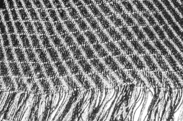 istock Texture, background, pattern. Women's scarf, striped fabric Black white lines intertwined 1053894008