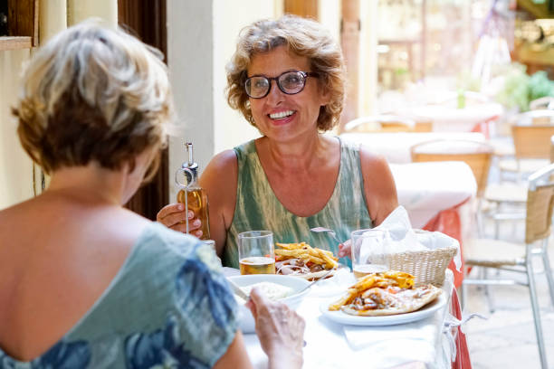 istock Two Senior women exploring the Corfu town 1053901710
