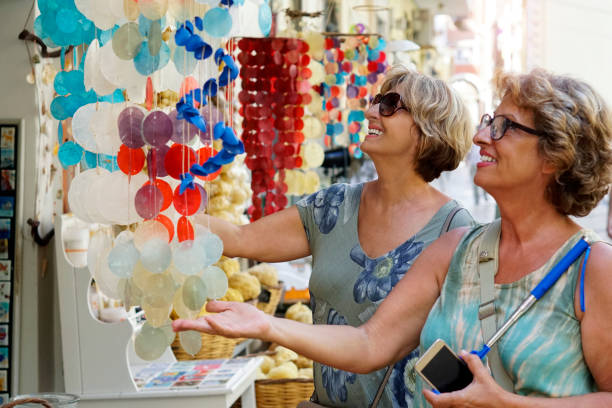 Two Senior women exploring the Corfu town stock photo