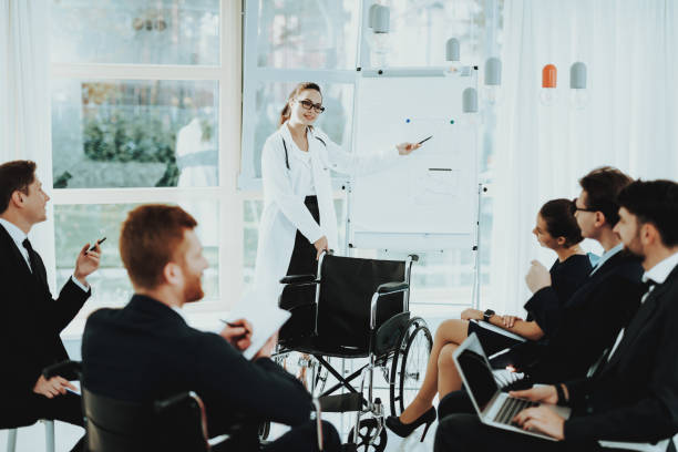 istock Group Disabled People with Doctor White Coat. 1053909402
