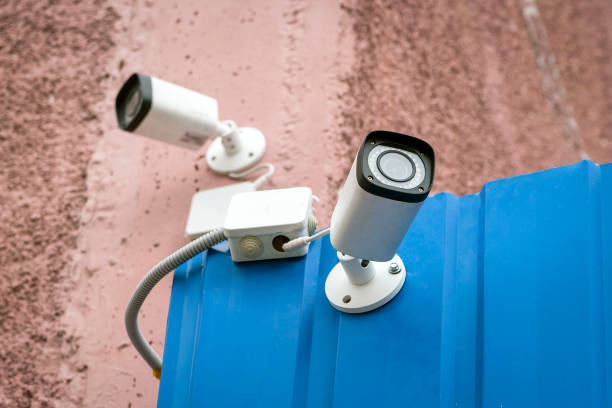 istock Surveillance camera on the wall of the building 1053915882