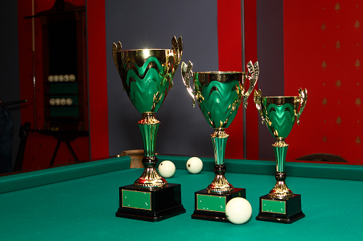 Cups for awarding in a billiard match.