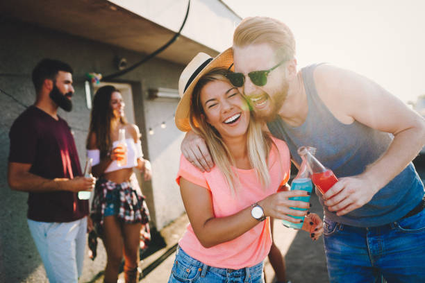 istock Happy couple having fun time at party 1053918642