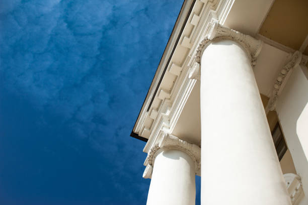 istock Low angle view of sky and columns Architectural Column Against clear Blue Sky sunny day 1053920282