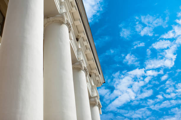 istock Low angle view of sky and columns Architectural Column Against clear Blue Sky sunny day 1053920292
