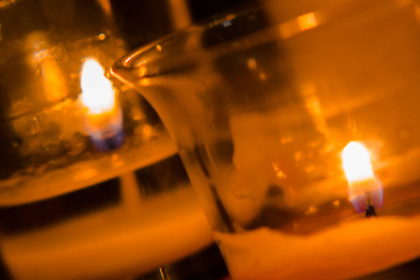 istock macro shot of lit candles lighting up a room 1053922894
