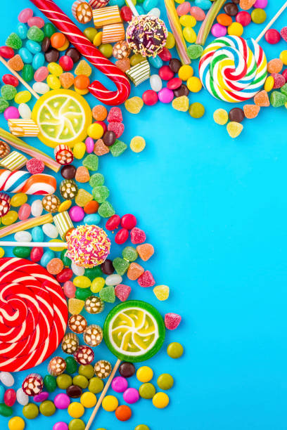 istock Colorful lollipops and different colored round candy. Top view. 1053923416