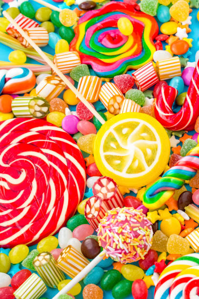 istock Colorful lollipops and different colored round candy. Top view. 1053923518