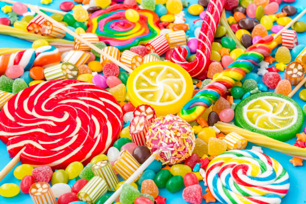 istock Colorful lollipops and different colored round candy. Top view. 1053923594