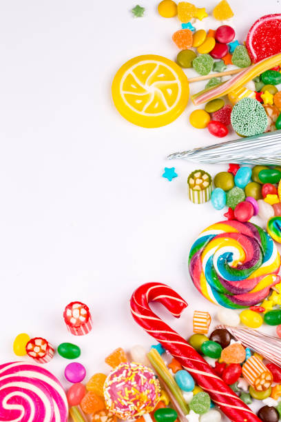 istock Colorful lollipops and different colored round candy. Top view. 1053924872