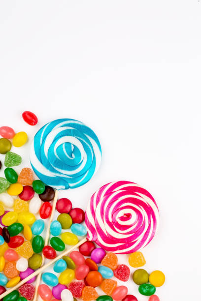 istock Colorful lollipops and different colored round candy. Top view. 1053925102
