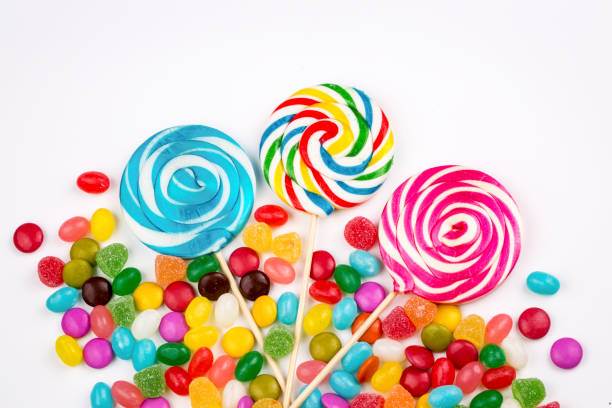 istock Colorful lollipops and different colored round candy. Top view. 1053925232