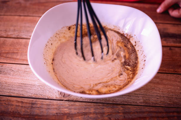 istock Pumpkin pie making - preparing sweet filling 1053925250