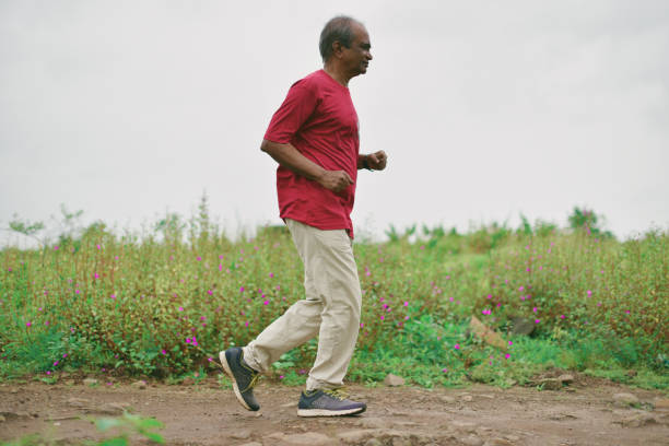 istock Senior man jogging on the hills 1053925256