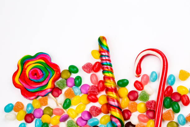 istock Colorful lollipops and different colored round candy. Top view. 1053925300