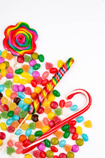 istock Colorful lollipops and different colored round candy. Top view. 1053925304