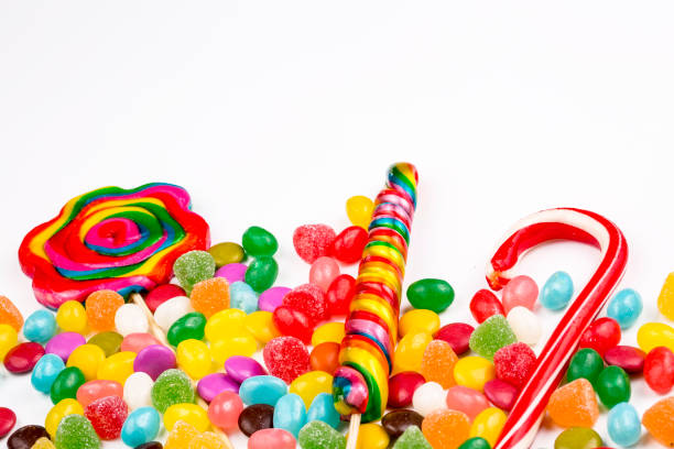 istock Colorful lollipops and different colored round candy. Top view. 1053925314