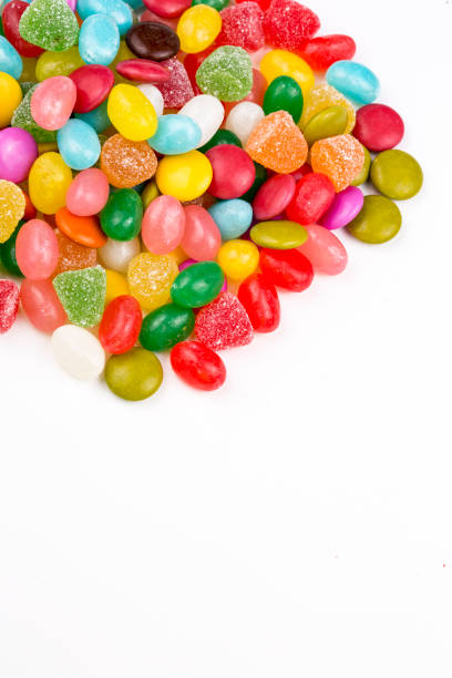 istock Colorful lollipops and different colored round candy. Top view. 1053925380