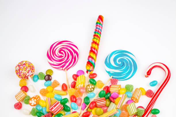istock Colorful lollipops and different colored round candy. Top view. 1053925558