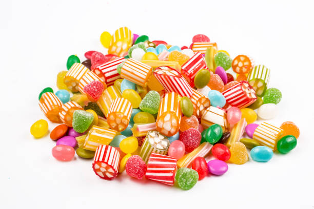 istock Colorful lollipops and different colored round candy. Top view. 1053925618