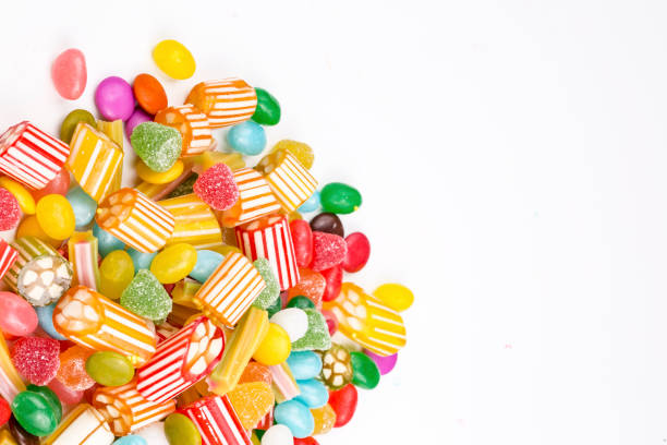 istock Colorful lollipops and different colored round candy. Top view. 1053925668