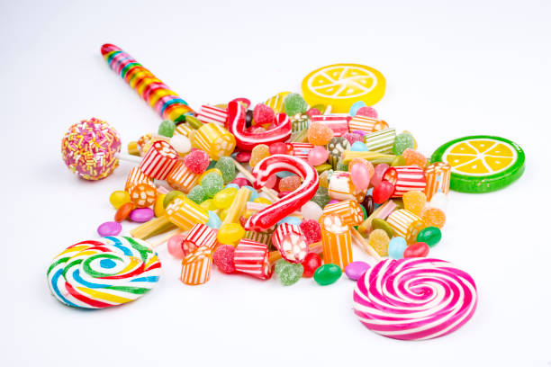 istock Colorful lollipops and different colored round candy. Top view. 1053925690