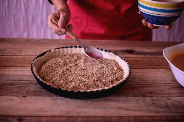 istock Pumpkin pie making - preparing sweet filling 1053925814