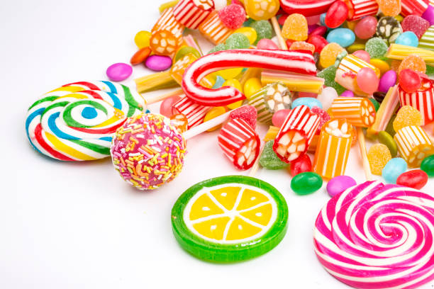 istock Colorful lollipops and different colored round candy. Top view. 1053925830