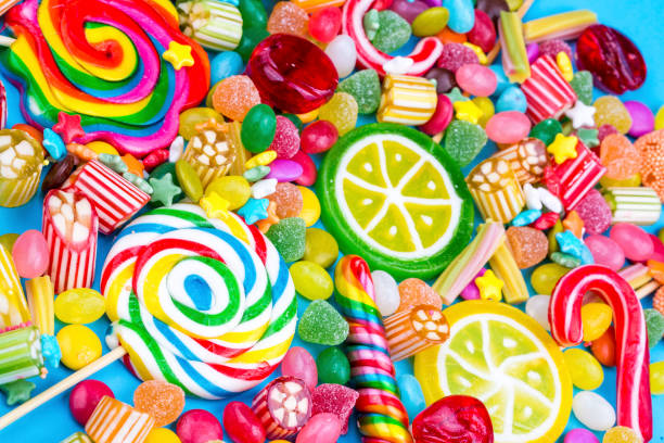 istock Colorful lollipops and different colored round candy. Top view. 1053925850