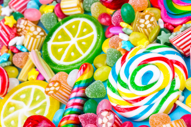 istock Colorful lollipops and different colored round candy. Top view. 1053925852
