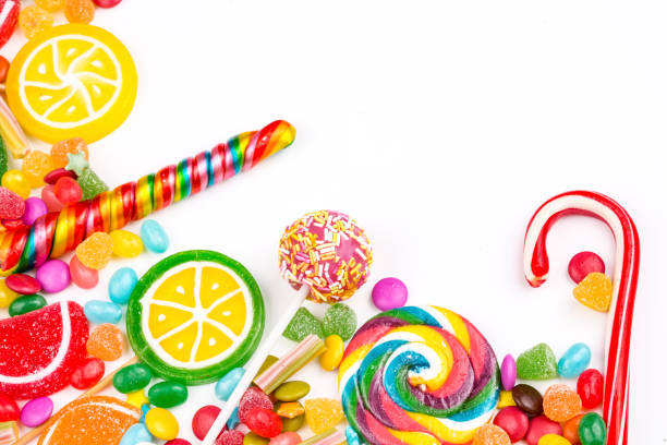 istock Colorful lollipops and different colored round candy. Top view. 1053926072