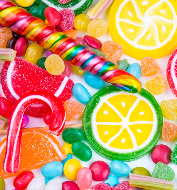 istock Colorful lollipops and different colored round candy. Top view. 1053926166