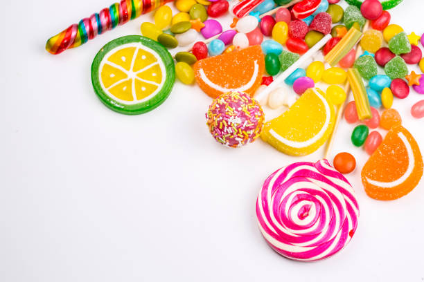 istock Colorful lollipops and different colored round candy. Top view. 1053926174