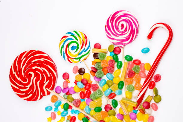 istock Colorful lollipops and different colored round candy. Top view. 1053927596