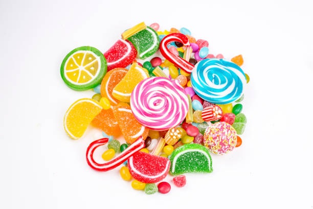 istock Colorful lollipops and different colored round candy. Top view. 1053928376