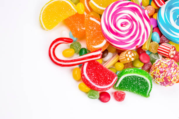 istock Colorful lollipops and different colored round candy. Top view. 1053928388