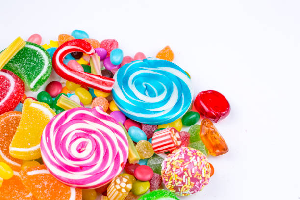 istock Colorful lollipops and different colored round candy. Top view. 1053928396